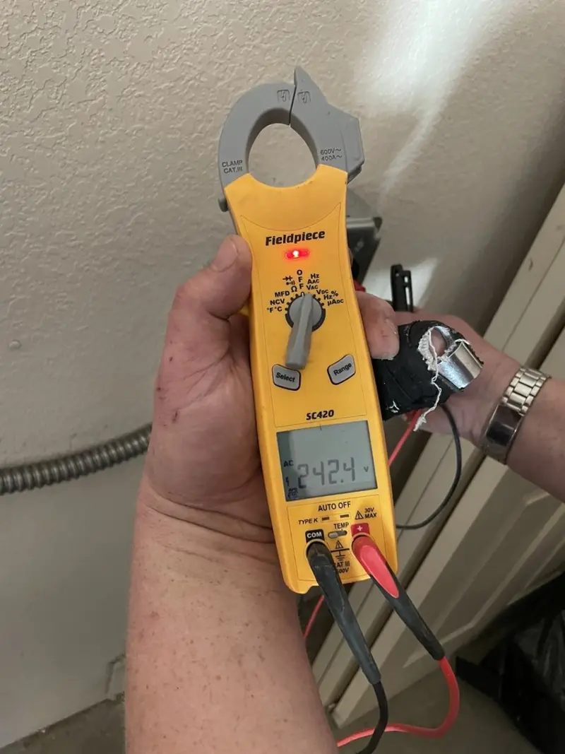 Voltage testing with clamp meter during Electrical Installation Services in Elmhurst